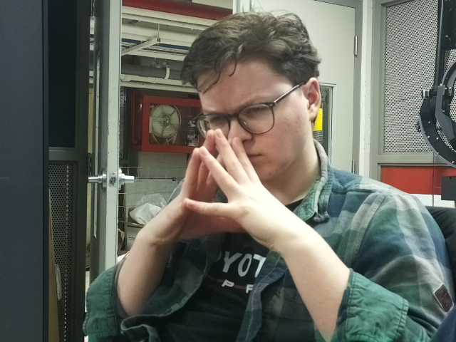 Aidan contemplating an engineering problem in the lab