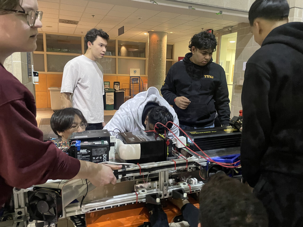 Hyperloop team working together on the pod systems
