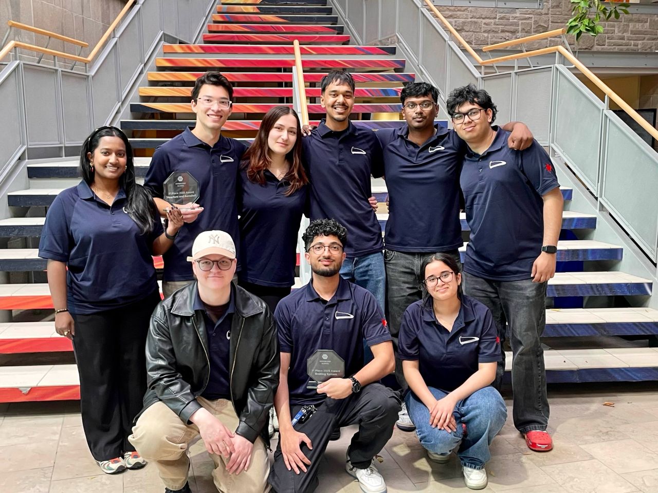 Hyperloop team members with their competition awards