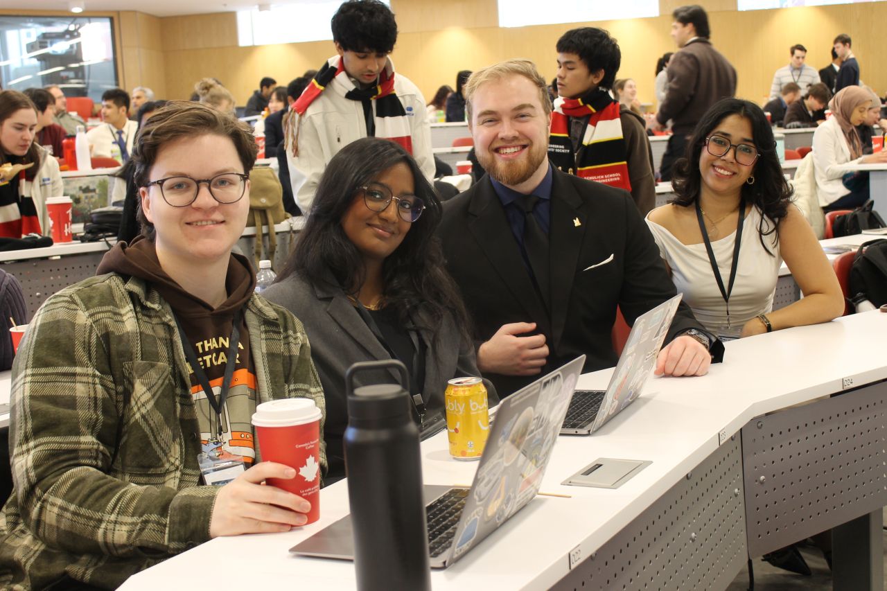 Aidan with fellow engineering students at a technical event