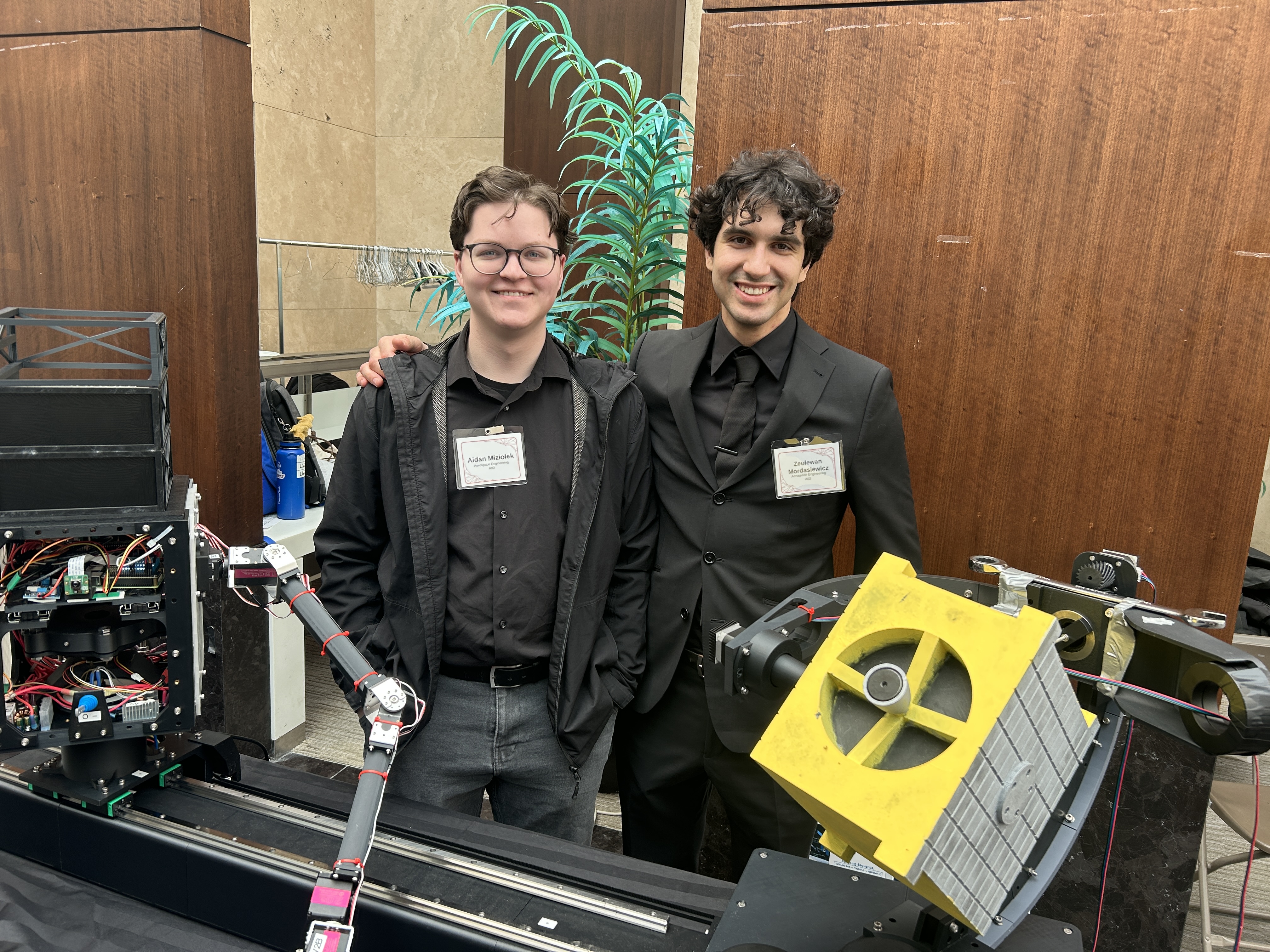 Aidan and a teammate presenting engineering prototypes